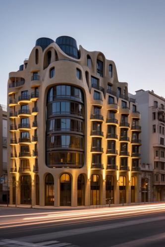a_modern_apartment_building_at_dusk_in_front_of_a_city_736d90af-6179-4878-a199-9addb572e6f0